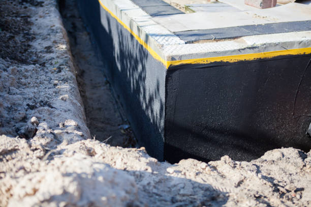 Professional Waterproofing technician working in Patchogue, NY